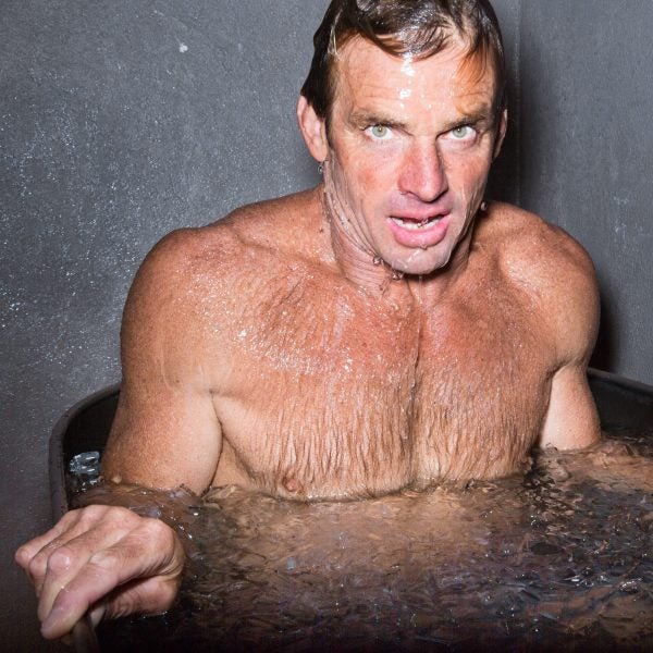 Big Wave Surfer Laird Hamilton takes a bath in an ice tub.