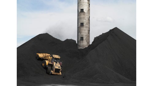 Coal storage at the TS Power Plant; Newmont Mining Corporation, Dunphy, Nevada, 2012.
The TS Power Plant, located on the TS Ranch in Dunphy, Nevada, supplies electricity to the Newmont Mining Corporation to power one of the corporation's gold mines. The ranch uses produced water from the company’s nearby gold mine to irrigate alfalfa. That alfalfa hay is then fed to 5,500 commercial cattle.
The nuggets of gold that made the American West famous have been gone from Nevada for generations. It is now profitable to mine gold if there is one-tenth of an ounce of gold dust in 2,000 pounds of rock.