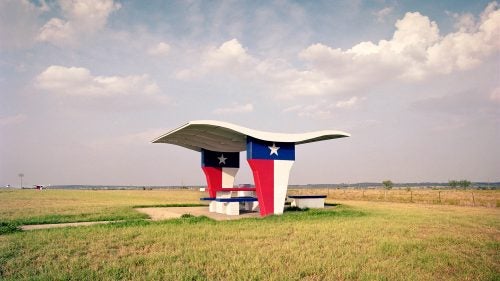 When photographer Ryann Ford moved to Texas in 2007, she began driving across the state, accepting photography assignments in every corner. Ford would take the quickest, main highways on her way there and look for the more scenic routes on the way back. This is where she found remnants of America’s beautiful and often crumbling rest stops. Due to the recession of the late 2000s, many of these great pieces of Americana were destroyed or left to decay. Ford made it her mission to capture as many as she could before they were gone. Her latest book, The Last Stop, is a stunning collection of charismatic rest stops across the country. Here, Ford shares some of her favorites and a few stories from the road. Photo: Flower Mound, Texas, I-35. This was the rest stop that inspired the project. As I researched rest stops to see what was beyond the Austin area, I was excited to find a photo of this one, and then shocked to read it would soon be demolished. The next weekend, I drove four hours north to shoot it. Sure enough, it was demolished a few weeks later.