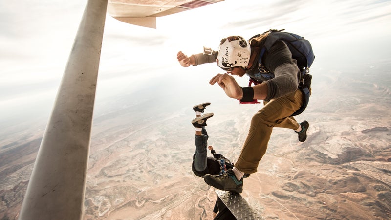Adam Krum (top) and Nicholas Reyes of Skydive Moab taking flight above canyon country.