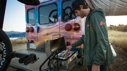 Making breakfast on the grill that’s permanently attached to the hitch.