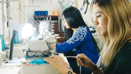 Co-founders of the swimsuit line Renata and Gabi at work in the shop.
