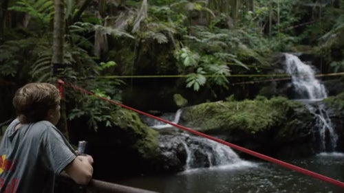 At just 19 years old, Alex Mason is one of the youngest phenoms in slacklining. He’s traversed the globe to compete, winning the Teva World Cup and the Slackline World Championships, all before he graduated high school. For his biggest project yet, he teamed up with his mentor, “Sketchy” Andy Lewis, and a Redbull film crew to trickline his way through the world’s first “slackladder” — a term coined by Redbull. In June, their crew of about 25 people headed for Hawaii’s Big Island to spend four days constructing the ladder, a series of 12 slacklines and other obstacles strung together to ascend a waterfall.
A far cry from the loud slackline competitions Mason is used to, the jungle of Hilo provided a serene backdrop for one of the coolest slackline videos we’ve ever seen. Outside caught up with Mason and Lewis to learn more about their motivation for the project, and find out what’s next for the sport of slacklining.
Photo: Mason mentally prepares to take on the slackladder. It has 12 interconnected lines, for a total length of more than 2 miles.