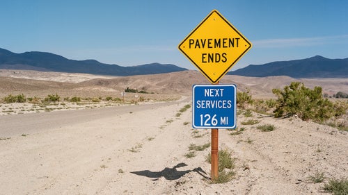 Scott Swaney, a former oilman and current badass a couple years shy of 70, has more first descents in Death Valley National Park than anyone on earth. He spent the past decade looking for everything from tight canyons to massive drop-offs and is believed to have led or been involved with 203 of the 258 first descents in the park. Swaney has burned through partners who couldn’t stand the heat and hard labor of exploring his hellish playground, but he continues to recruit new ones, eager to keep exploring. This spring, photographer Ian Tuttle, who had never canyoneered, stuffed his camera—a film Mamiya 645 AFDii—into a backpack and followed along.
Photo: Death Valley Road, Inyo County, California.
Death Valley is enormous, hot, dry, rugged, and remote. It’s the largest national park outside Alaska and holds the world record for hottest air temperature (134 degrees Fahrenheit). Of its 3 million acres, 91 percent is designated wilderness. It’s not a friendly place if you don’t know what you’re doing. As of this writing, there is only one paved road across the park—flash floods wiped out the other two in 2015. Cell service is sporadic at best. To have any chance of seeing much more than the tourist sites, you need to hike, carrying all of your water, for miles across open desert.
