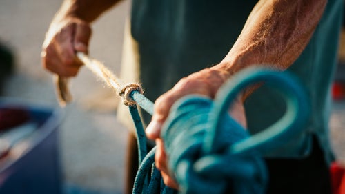 Swaney demonstrating a Prusik knot. Amargosa Valley, May 2, 2016.
There are five of us on this trip, and we car-camp that night on the Amargosa Valley floor, a few feet from a wilderness boundary sign. Swaney teaches me the Prusik knot, explains ascenders, and talks about how it’s likely that no human has ever been where we’re going.