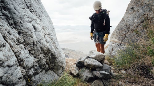 Swaney inspects a rock-pile anchor in Sand Witch Canyon. May 21, 2016.
We are now climbing a steep ridgeline toward an unnamed summit, at which point we’ll traverse around and drop into a drainage that will deepen into a canyon. I ask Plummer if I can trust Swaney. Plummer’s accompanied him on about 30 canyoneering trips in Death Valley, including many first descents. He tells me that Swaney knows what he’s doing. He also tells me that I need to make my own decisions about what is safe and what is not. I respect his response.