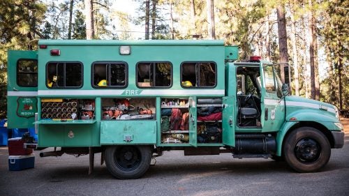 You need the right gear to go trail running, skiing, or mountain biking. You really need the right stuff if you spend weeks fighting infernos in the middle of a forest. To find out what wildland firefighters rely on, we hooked up with Kevin Mecham, a 12-year veteran with the Tahoe Hotshots.
International Crew Haul
Mecham and the Tahoe Hotshots named their 2006 two-wheel-drive crew hauler Eight Ball. The squad boss drives, the captain rides shotgun, and the eight crew members sit in the back, with the most senior toward the front and the newest guys in the back. All of their tools go into side compartments, while their personal gear fits in racks and nets above the seats.