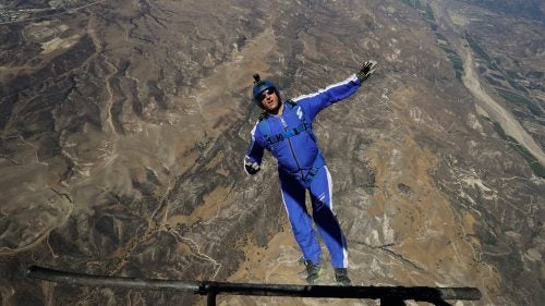 On July 30 at approximately 5:45 p.m. local time, Hollywood stuntman and skydiving luminary Luke Aikins jumped out of a Cessna Grand Caravan airplane 25,000 feet above Simi Valley, California. It was the first time in his 18,000-plus skydives that Aikins, 42, with a wife and young son, did not wear a parachute. The “Stride Gum Presents: Heaven Sent” stunt, which 1.44 million viewers watched live on Fox, made history when Aikins landed safely in a large net suspended 200 feet above the ground by a quartet of cranes.
Aikins and a small army of producers planned the jump for two years. He was joined in freefall by a trio of support jumpers, including his cousin, fellow aerial wizard Andy Farrington; but they all had parachutes and deployed them as Aikins continued plummeting toward the ground. When Aikins landed successfully, he became the first skydiver to intentionally land a jump sans chute and survive (British wingsuit pilot Gary Connery famously landed in a pile of cardboard boxes in 2012 without a chute, after jumping from a helicopter 2,400 feet above the ground). Here, we recount his jump and how he managed a happy ending.
Photo: Aikins practiced for months leading up to the jump, honing every detail to ensure maximum safety through training leaps like this one, five days before his fateful freefall. Still, not everything went off without a problem. Twenty-five hours before his jump, the Screen Actors Guild threatened to require Aikins to wear a parachute for safety; but the Hollywood union lifted that clause shortly before the freefall began.