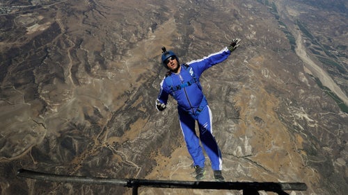 On July 30 at approximately 5:45 p.m. local time, Hollywood stuntman and skydiving luminary Luke Aikins jumped out of a Cessna Grand Caravan airplane 25,000 feet above Simi Valley, California. It was the first time in his 18,000-plus skydives that Aikins, 42, with a wife and young son, did not wear a parachute. The “Stride Gum Presents: Heaven Sent” stunt, which 1.44 million viewers watched live on Fox, made history when Aikins landed safely in a large net suspended 200 feet above the ground by a quartet of cranes.
Aikins and a small army of producers planned the jump for two years. He was joined in freefall by a trio of support jumpers, including his cousin, fellow aerial wizard Andy Farrington; but they all had parachutes and deployed them as Aikins continued plummeting toward the ground. When Aikins landed successfully, he became the first skydiver to intentionally land a jump sans chute and survive (British wingsuit pilot Gary Connery famously landed in a pile of cardboard boxes in 2012 without a chute, after jumping from a helicopter 2,400 feet above the ground). Here, we recount his jump and how he managed a happy ending.
Photo: Aikins practiced for months leading up to the jump, honing every detail to ensure maximum safety through training leaps like this one, five days before his fateful freefall. Still, not everything went off without a problem. Twenty-five hours before his jump, the Screen Actors Guild threatened to require Aikins to wear a parachute for safety; but the Hollywood union lifted that clause shortly before the freefall began.