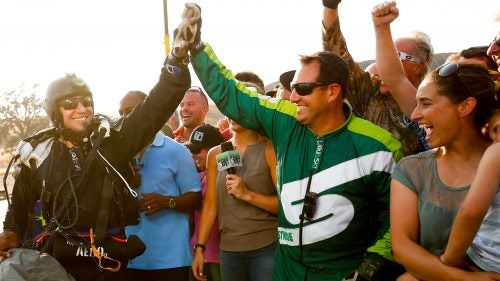 A swarm of family and friends awaited Aikins after the jump and celebrated his historic feat on-air. Chief among them: his wife and four-year-old son (at right). Aikins was adamant he would pull out of the jump at the last minute if all of his safety systems weren’t perfect or if the wind was stronger than 15 mph. “I got a family,” he said. “I don’t have a death wish.”