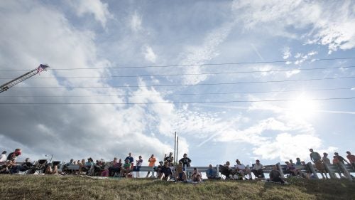People arrive hours before the start to grab their favorite spot and watch the mad dash to the water.