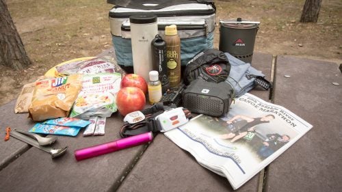 The essentials of survival. The official spectator packing list includes a music player, lawn chairs, binoculars, insect repellent, soap, towel, toothbrush, toilet paper, pillows, alarm clock, rain gear, food, flashlight, and a portable scanner that can tune in to live updates of team times throughout the race.