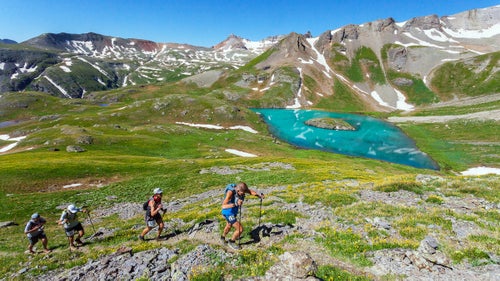 At 100 miles long, and with more than 33,000 feet of elevation gain and descent, the Hardrock 100 has long been considered one of the world’s toughest ultras. The 2016 race in Southern Colorado’s San Juan mountains drew 152 of some of the world’s best runners, and only 115 finished. Anna Frost took the women’s title for the second year in row while Kilian Jornet and Jason Schlarb walked across the finish line together to share the victory. Photographer Daniel Sohner was there, camera in hand, to see it all unfold. Here, Sohner shares of a few of his favorite images from the race. Photo: Early on in the race, runners climb above Island Lake toward Grant Swamp Pass.
