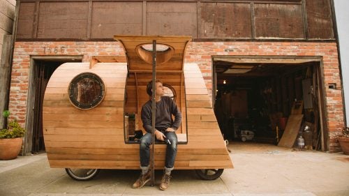 Ten years ago, Nelson cobbled together his first mobile camper, a wooden snail shell that sat on the back of a Honda Civic and served as his home while he chased swells at Ocean Beach.