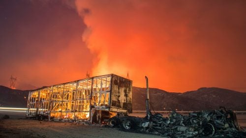 The Blue Cut Fire burns in San Bernardino County on the evening of August 16, 2016.
During fire season, Palley’s bags are always packed so he can run off if something breaks out. The Blue Cut fire was near his house so he came home each night. But during other fires, he’ll spend days on the road, and can also go days without sleeping.
The Blue Cut Fire burns in San Bernardino County Tuesday evening August 16th, 2016. The fire had burned 15,000 acres and was 0% contained, with multiple structures threatened and destroyed. Interstate 15 was also shut down at the 215.