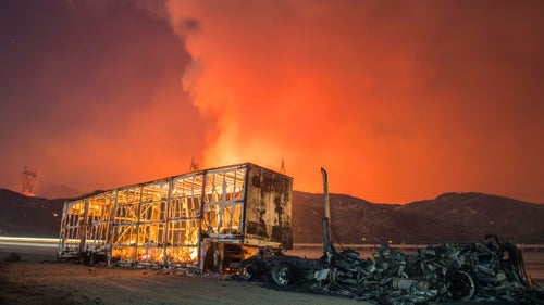 The Blue Cut Fire burns in San Bernardino County on the evening of August 16, 2016.
During fire season, Palley’s bags are always packed so he can run off if something breaks out. The Blue Cut fire was near his house so he came home each night. But during other fires, he’ll spend days on the road, and can also go days without sleeping.
The Blue Cut Fire burns in San Bernardino County Tuesday evening August 16th, 2016. The fire had burned 15,000 acres and was 0% contained, with multiple structures threatened and destroyed. Interstate 15 was also shut down at the 215.
