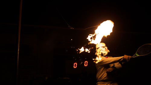 The “ball” in flaming tetherball is a roll of toilet paper soaked in three ounces of white gas, the stuff that saner people use in camp stoves and lanterns. It burns nice and bright, but without the fumes of gasoline. That said, it’s wise to avoid applying hairspray before playing and to keep a fire extinguisher or four nearby. And a liability waiver or two.