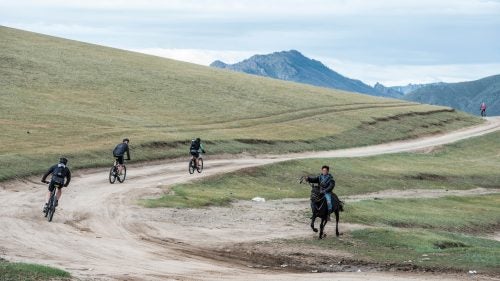 The Mongolia Bike Challenge may be the most demanding mountain-bike race on earth. Started in 2010 as a ten-day event with multiple stage lengths in excess of 100 miles, the route takes riders through remote and mountainous terrain teeming with wild horses and with little in the way of course marshals—it’s each racer’s responsibility to carry a GPS tracking device.
On August 20, 65 starters toed the line for what is now a six-day race with a long stage of 82 miles. The favorites included the defending champion, Italian World Cup racer Nicholas Pettina; Cory Wallace, a Canadian who won three straight years before Pettina and is arguably the top stage racer in the world; and Payson McElveen, a 23-year-old pro and first-time entrant from Austin, Texas, now living in Durango, Colorado. The week was a dogfight, with the top trio attacking each other from the first stage to the final 15-mile time trial. Ultimately McElveen came away with the win.
Barcelona-based Italian photographer Paolo Martelli documented the race. “Mongolia, to me, is about getting far, far away to try to get closer to yourself,” he says.
Photo: “We saw kids on horses running around all the time,” McElveen says. “Those people live on horses. You’d see five- or six-year-olds on big horses sometimes, but a lot of time they seemed to have horses their size.”