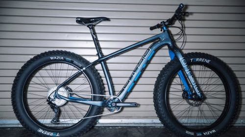 From a featherlight race 29er to a fattie that pedals like a normal steed, these were some of the coolest and most promising new rides we saw at Interbike. Just starting out? Learn everything you need to know about buying your first mountain bike.
Photo: Otso Voytek
Otso is a new bike brand from the same folks behind Wolf Tooth Components, and their two new bikes, including the Voytek, are as clever and well-conceived as their small parts. Otso engineer and brand manager Brendan Moore calls it a “plus bike that fits fat,” because the carbon frame can be equipped to accommodate both 27.5+ and 29+ wheels, as well as 26ers with up to 4.6 rubber. The versatility comes courtesy of a proprietary, three-way flip chip at the rear dropouts, which not only allows the wheel swaps but also makes it possible to change the rear chain stay length (between 430mm and 450mm in ten millimeter increments), thereby changing the bike’s entire feel and handling. The Voytek also has the narrowest Q-factor of any fat bike out there (thanks to a special Wolf Tooth chain ring), which will make it ride more like a standard hard tail than a fatty. It’s the bike I’ve been wanting for years because, at last, your year-round rig can double as a winter fattie without compromise in either format. Complete bikes start at $3,900.