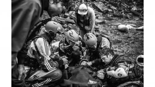 Spirit category winner by Dean Treml
Josh Neilson (center) of New Zealand is supported by fellow paddlers as he waits for a helicopter evacuation after a bad landing off Matze's Drop, Storulfossen, Norway on July 7, 2014. It left him with a broken L1 vertebrae.”