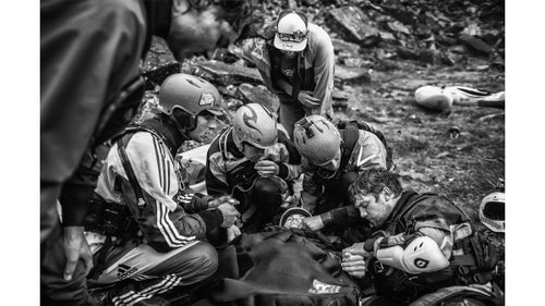 Spirit category winner by Dean Treml
Josh Neilson (center) of New Zealand is supported by fellow paddlers as he waits for a helicopter evacuation after a bad landing off Matze's Drop, Storulfossen, Norway on July 7, 2014. It left him with a broken L1 vertebrae.”
