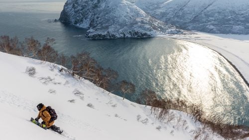 “Rice hiking on the Kamchatka Peninsula searching for soft snow. This location definitely provided some of the harshest weather swings we experienced during the production. It felt like we were on the moon. Super high winds, super gnarly temperature swings. We ended up with tons of exposed ice. Full melt, then full freeze, over and over, but we never got that good system that blanketed the mountains. Eventually, we decided to cut our losses. Rice had brought a bunch of surfboards, and we found this great cold-water surf break out there.”