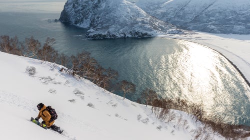 “Rice hiking on the Kamchatka Peninsula searching for soft snow. This location definitely provided some of the harshest weather swings we experienced during the production. It felt like we were on the moon. Super high winds, super gnarly temperature swings. We ended up with tons of exposed ice. Full melt, then full freeze, over and over, but we never got that good system that blanketed the mountains. Eventually, we decided to cut our losses. Rice had brought a bunch of surfboards, and we found this great cold-water surf break out there.”