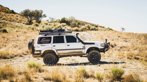 Toyota’s Land Cruiser, arguably the most iconic four-wheel drive ever made, went into production in 1954. Since then, the company has released many iterations of this vehicle, all of which have a reputation for indestructibility and bet-your-life-on-it reliability. To celebrate the car’s legacy, Land Cruiser owners from all over the U.S. gather each year at the Land Cruiser Heritage museum in Salt Lake City for Cruiser Fest. This year, we sent photographer Louis Arevalo to photograph the drivers, their steeds, and some special edition Land Cruisers that live in the museum.
Photo: Luis Vassallo, from Weston, Florida, with his 2005 FJ80 during a stop in Eureka, Utah, on the way to the event. Vassallo was part of an overland group that drove on dirt roads from Green River, Utah, to Salt Lake City.