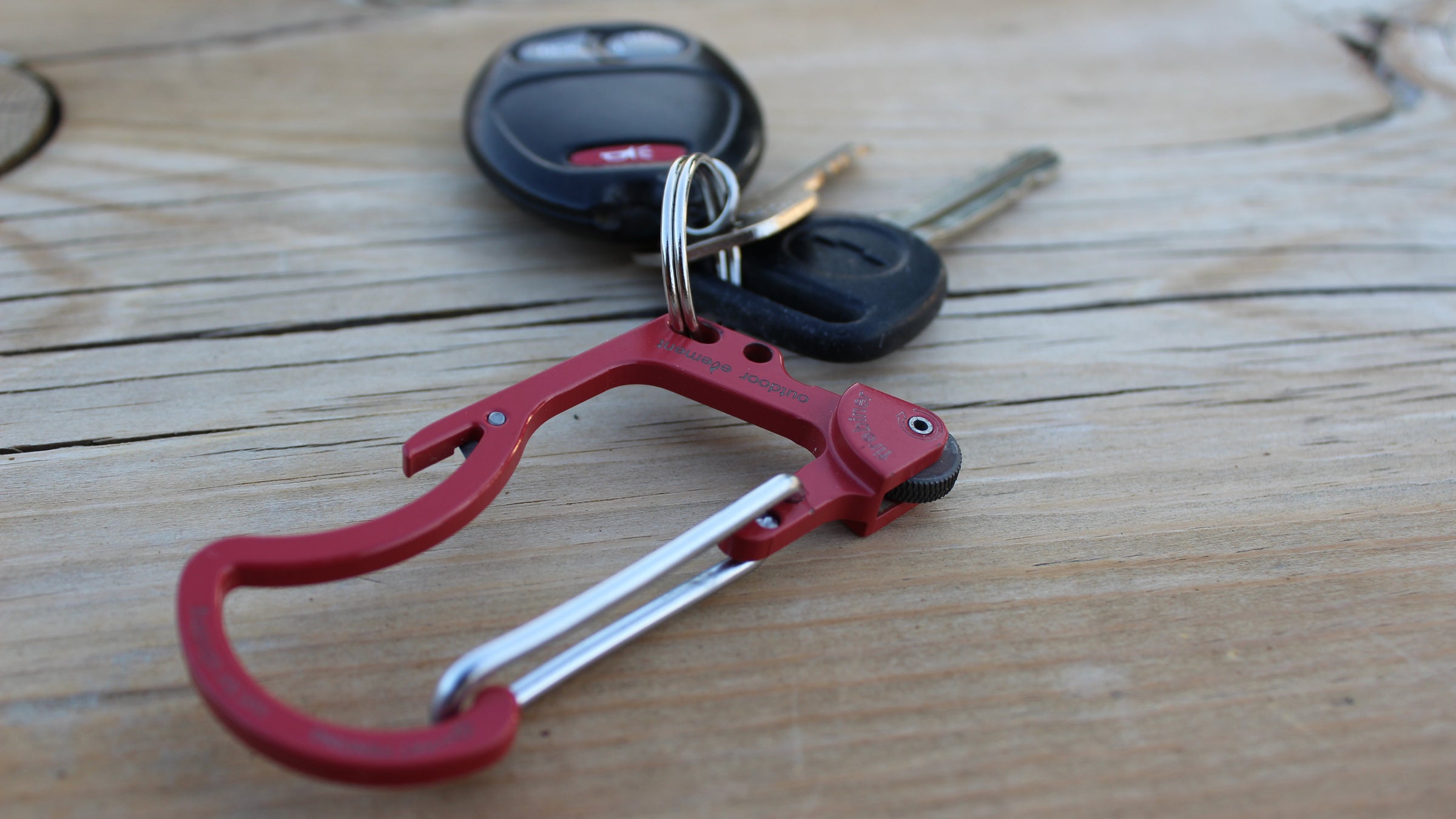 Start a fire and open a beer with the same tool.