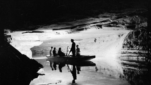 This dramatic shot from 1939 shows visitors on a guided boat tour of Echo River in Mammoth Cave. The boat tour was a huge attraction at the park, but was discontinued in 1990 in order to protect aquatic species.