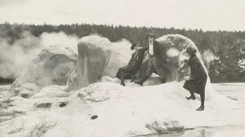 Visitors clamber all over Grotto Geyser in Yellowstone in this undated photo.