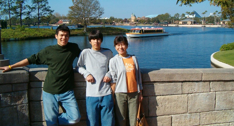 David Fry, center, with his brother, Daniel, and mother, Sachiyo, during a family trip to Disney World.