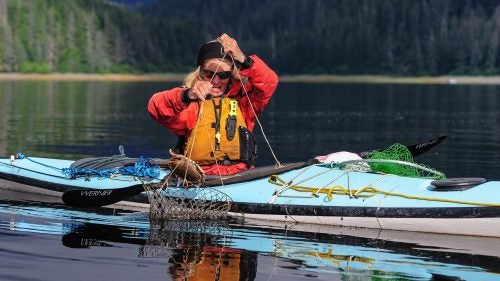 Crabbing was a new endeavor for us, and actually turned out to be quite profitable. In shallow, protected waters, we experimented with various ways to catch crabs, including reaching down and grabbing them. The baited crab ring in this photo was one of the best methods.