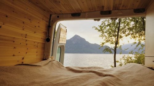 In 2014, Nikki and Jakob Celnik left their corporate jobs in New York City and bought a used Sprinter. They spent the following seven weeks designing and building the van, and then planned a two-year drive from Canada to Argentina. Highlights include mountain biking throughout Canada, climbing in Mexico, getting caught in one of the worst hurricanes ever to hit Baja, and staying with a local family in Colombia. They returned to New York in October with lots of photos and stories to share.
Photo: When the weather was good, we’d swing the back doors open. It was as if we were camping in a tent without having to set anything up. This was the view from our first night camping on the Pacific Ocean, just north of Squamish, British Columbia.