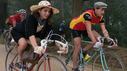 Riders drop out of the forest on Strade Bianche, the famed white gravel roads of Tuscany.