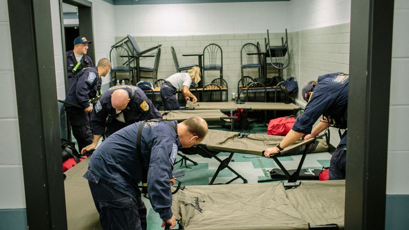 Setting up cots at Hunter Army Airfield.