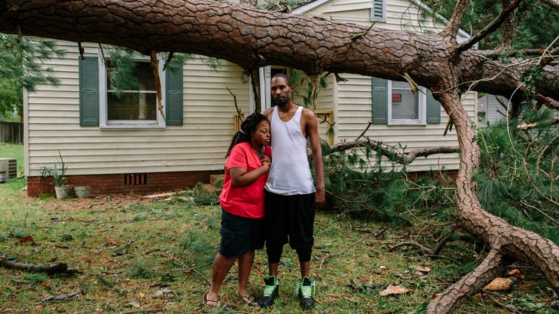 A large tree fell in front of Shantea and Malcolm Craig's house in a suburb of Savannah while they slept inside their bedroom at the front of the house. The tree missed them by a few feet.
