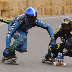 Kyle Wester (center) broke the skateboarding world record for speed this September, recording a speed of 89.41 miles per hour.