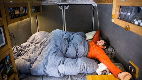 Honnold in his new, larger bed. He slept at an angle in the old Ford van because the bed wasn’t quite long enough. The new bed also has sheets and a comforter instead of just a sleeping bag on top. “When I moved into a real bed like this, I was like, ‘This is quite a bit more comfortable than a sleeping bag.’ It makes me a little concerned that I’m getting soft, though, and that this is so indulgent.”