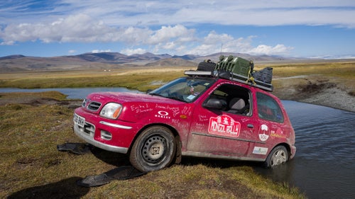 How about this for a vacation idea? Fly to Europe, buy a beat-up clunker, then try to make it from England to Mongolia in one piece. There’s no official route and no official rulebook. Photographer Drew Gurian and his brother, Scott, did just that this summer as participants in the Adventurists’ Mongol Rally. They bought 990ML 60-horsepower Nissan Micras, and after 53 days, 18 countries, a couple broken axles, and an emergency extraction, they crossed the finish line. We talked to to the New York City–based photographer about some of his most memorable times on the road. Photo: Every day brought a different hole that we needed to be pulled out of. Here, our friends and adventure mates Rosi Moore-Fiander and Jane Box help us out of a crossing that proved too deep.