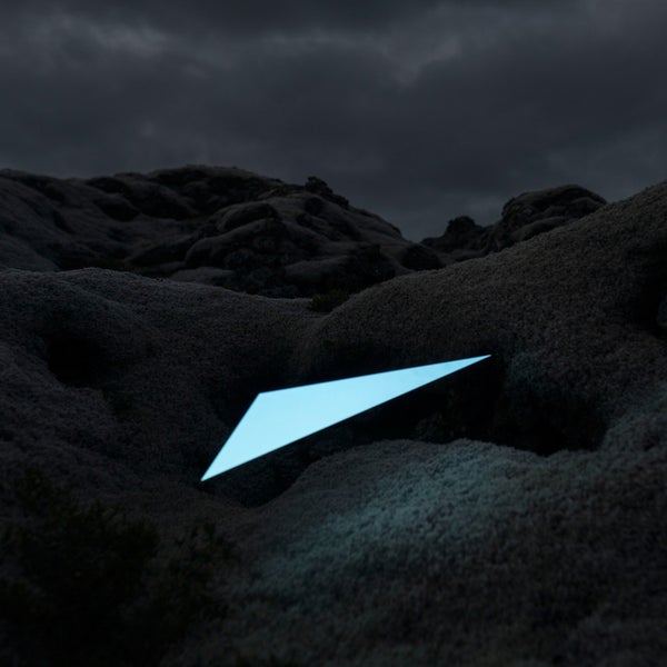 For installations like this, the photographers used a thin carbon stick attached to cardboard, then lit it using a normal projector.