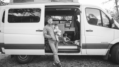 The man’s got a Sprinter, too. Here he holds his daughter, Ingrid, while his son, Fitz, plays with toy trucks.