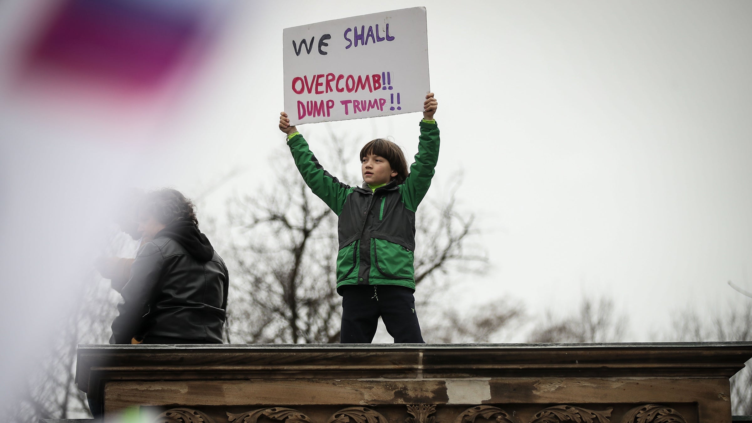 A  young protestor holds up a sign during the Women's March on Washington January 21, 2017 in Washington, DC.