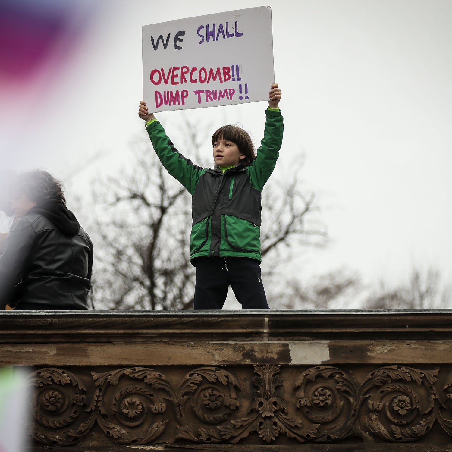 A young protestor holds up a sign during the Women's March on Washington January 21, 2017 in Washington, DC.