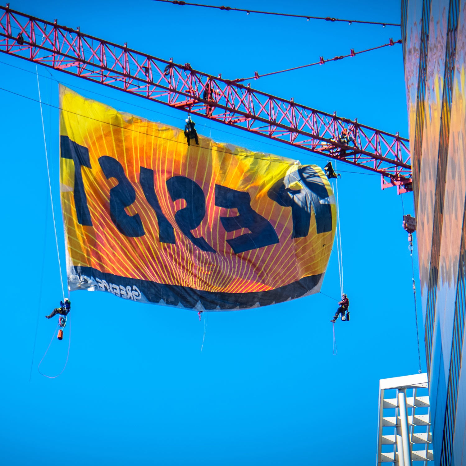 GreenPeace unfurls a