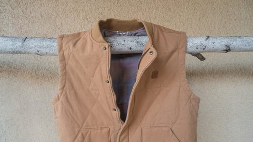 Roark Revival Heathen Vest ($90)
Thanks to the quilted outer, this cotton vest looks good at the bar, but it’s also made to take a beating while chopping wood.