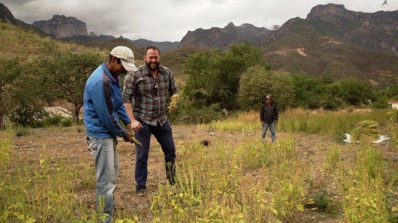 Health Warrior co-founder Shane Emmett and Silvino Cubesare in the field.