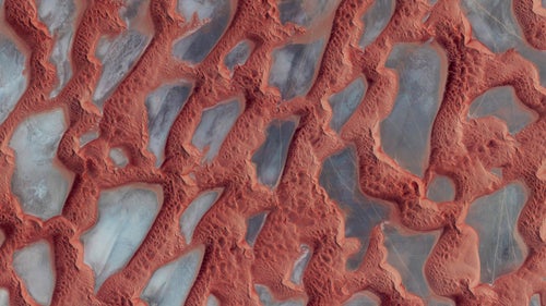 Rub’ al Khali, or the Empty Quarter, is the largest sand desert in the world. It covers 251,000 square miles, and includes parts of Saudi Arabia, Oman, Yemen, and the United Arab Emirates. In the center of the desert there are a number of raised, hardened formations that were once the sites of shallow lakes thousands of years ago. For a sense of scale, this image shows approximately 135 square miles in Saudi Arabia, near the border with Oman.