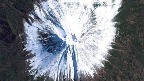 Mount Fuji is an active stratovolcano and the tallest peak in Japan, rising 12,389 feet. As seen in this image, Fuji has an extremely symmetrical cone, which is snow‐capped several months of the year. During warmer months, trekking routes make it possible for hundreds of thousands of people to scale the volcano each year.