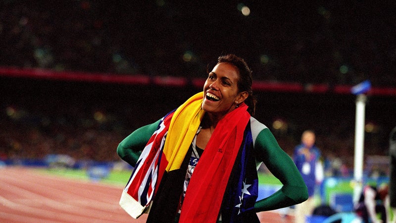 Cathy Freeman of Australia celebrates after winning gold in the women's 400-meter final at the 2000 Olympic Games in Sydney.